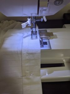 Stitching the tucks down